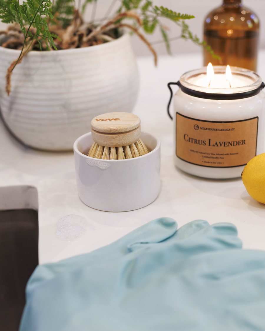 Candles and linens styled on a shelf